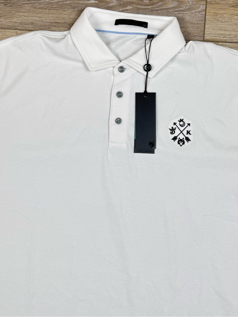Greyson White Polo with Black Crest Logo
